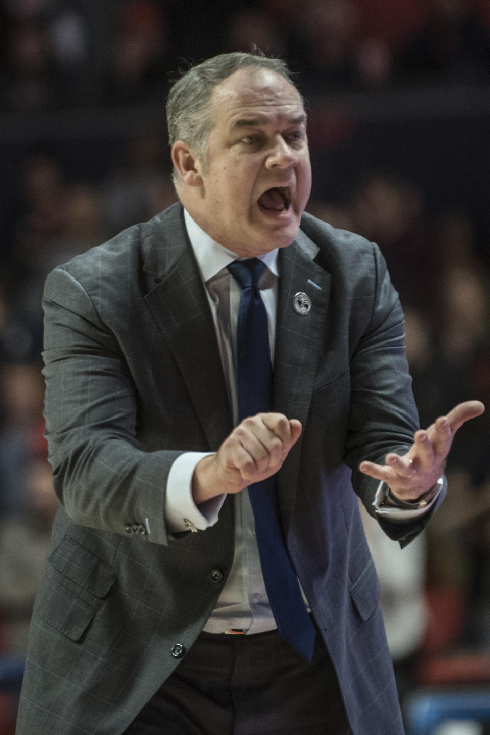 Rutgers head coach Steve Pikiell fires his team up against Illinois in the second half of an NCAA college basketball game, Sunday, Jan. 11, 2020, in Champaign, Ill. (AP Photo/Holly Hart)