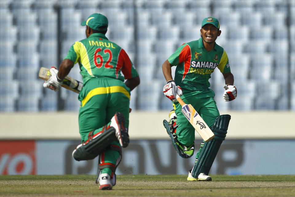 Bangladesh’s Anamul Haque, right, and Imrul Kayes run between the wickets during their match against Pakistan in their Asia Cup one-day international cricket tournament in Dhaka, Bangladesh, Tuesday, March 4, 2014. (AP Photo/A.M. Ahad)