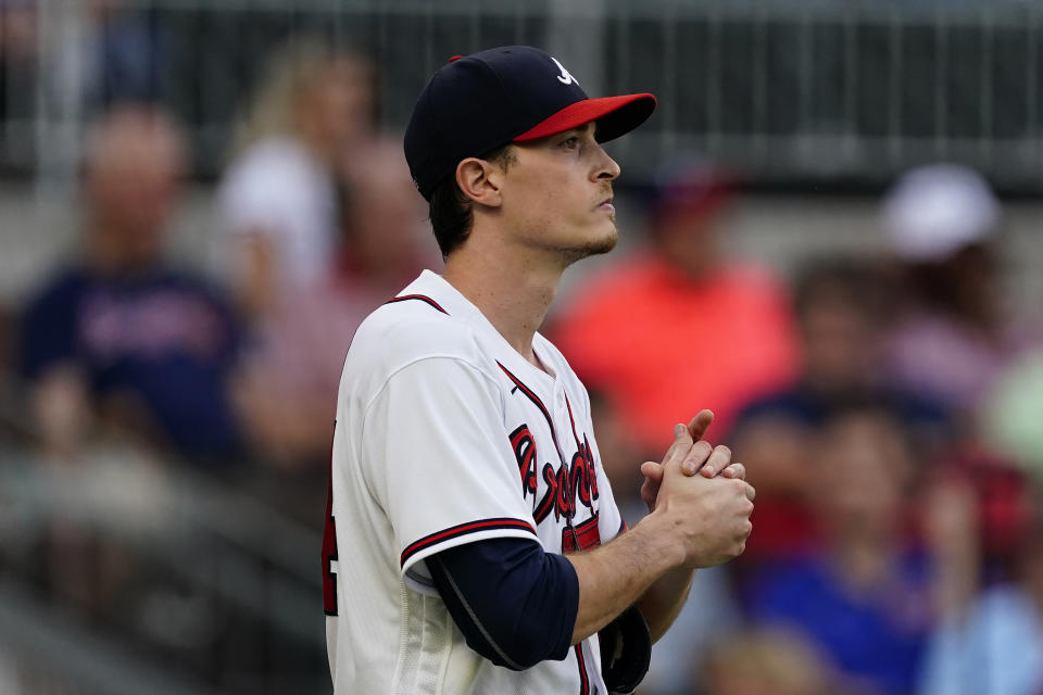 Atlanta Braves starting pitcher Max Fried walks back to the mound after allowing a run on a wild pitch in the first inning of a baseball game against the Washington Nationals Tuesday, June 1, 2021, in Atlanta. (AP Photo/John Bazemore)