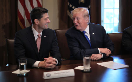 U.S. President Donald Trump talks with House Speaker Paul Ryan (R-WI) as he promotes a newly unveiled Republican tax plan with House Republican leaders in the Cabinet Room of the White House in Washington, U.S., November 2, 2017. REUTERS/Carlos Barria