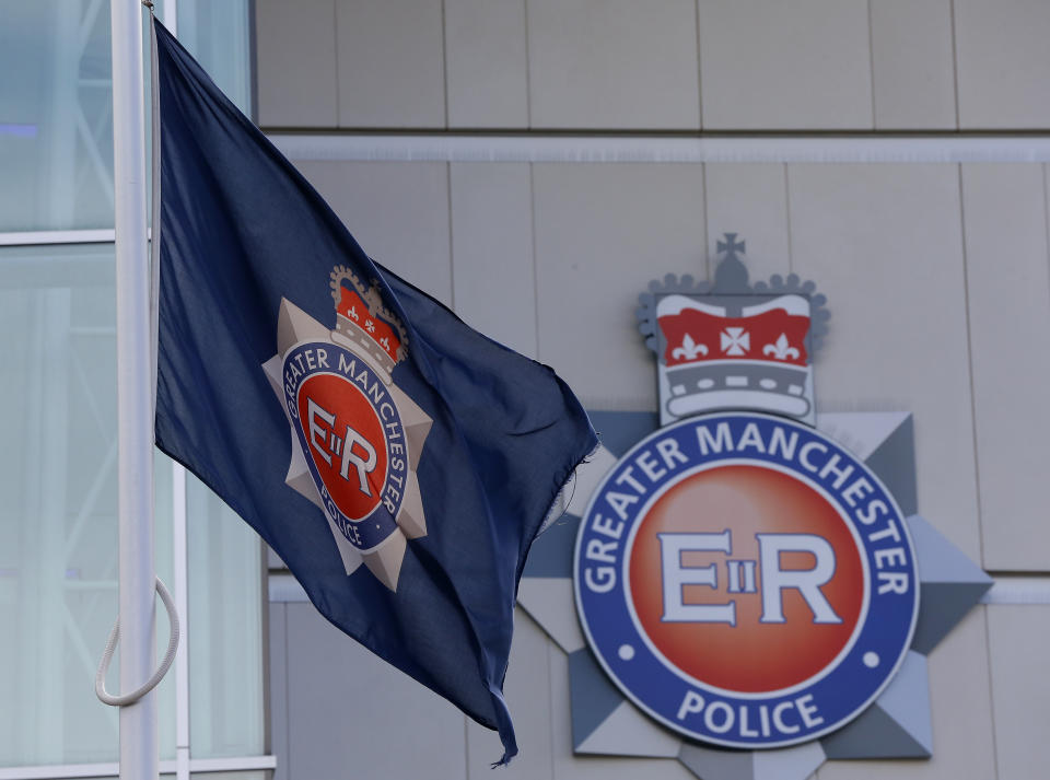 The force flag flies at half mast outside the Greater Manchester Police force headquarters in Manchester , northern England, September 19, 2012. One of Britain's most wanted fugitives killed two unarmed policewomen on Tuesday in a gun and grenade ambush, police said, killings which are likely to reignite a long-running debate over whether British officers should carry guns. REUTERS/Phil Noble (BRITAIN - Tags: CRIME LAW)