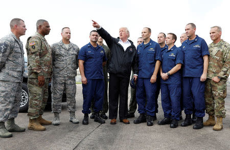 U.S. President Donald Trump speaks with troops and members of the United States Coast Guard at Ellington Field after meeting with flood survivors and volunteers who assisted in relief efforts in the aftermath of Hurricane Harvey, in Houston, Texas, U.S., September 2, 2017. REUTERS/Kevin Lamarque