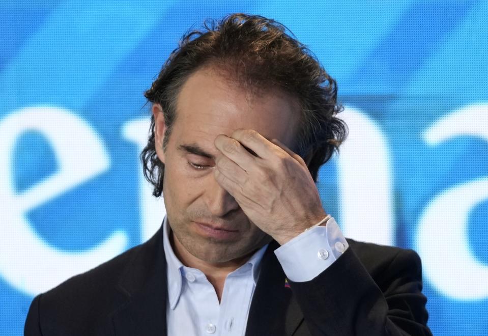 Federico Gutierrez, presidential candidate representing the Team for Colombia coalition, gestures during a presidential debate at the El Tiempo newspaper building in Bogota, Colombia, Monday, May 23, 2022, ahead of the first round May 29th elections. (AP Photo/Fernando Vergara)