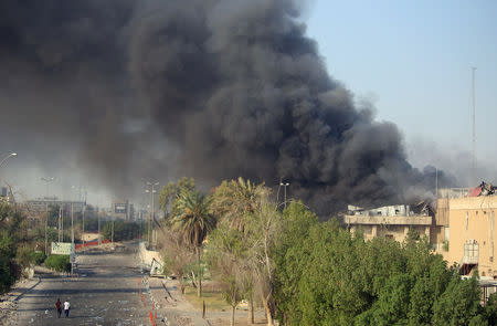 Smoke rises from the governorate and municipalities buildings of Basra, Iraq September 6, 2018. REUTERS/Essam al-Sudani