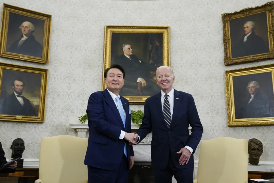 FILE - U.S. President Joe Biden, right, shakes hands with South Korea's President Yoon Suk Yeol as they meet in the Oval Office of the White House, on April 26, 2023, in Washington. (AP Photo/Evan Vucci, File)