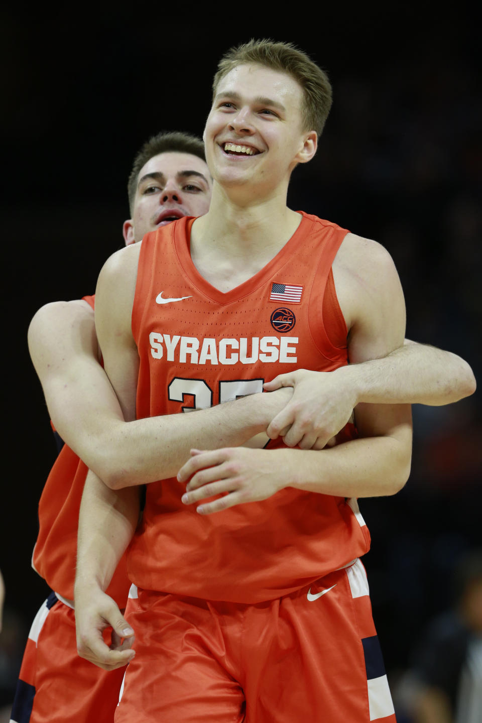 Syracuse guard Buddy Boeheim (35) celebrates a three point basket along with teammate Syracuse guard Joseph Girard III, left, during the second half of an NCAA college basketball game in Charlottesville, Va., Saturday, Jan. 11, 2020. Syracuse defeated Virginia 63-55. (AP Photo/Steve Helber)