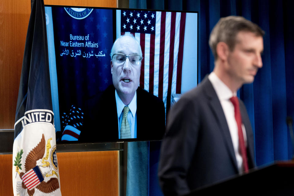 U.S. special envoy for Yemen Timothy Lenderking, seen on the monitor, joins State Department spokesman Ned Price virtually for a news conference at the State Department in Washington, February 16, 2021. / Credit: Andrew Harnik/AP