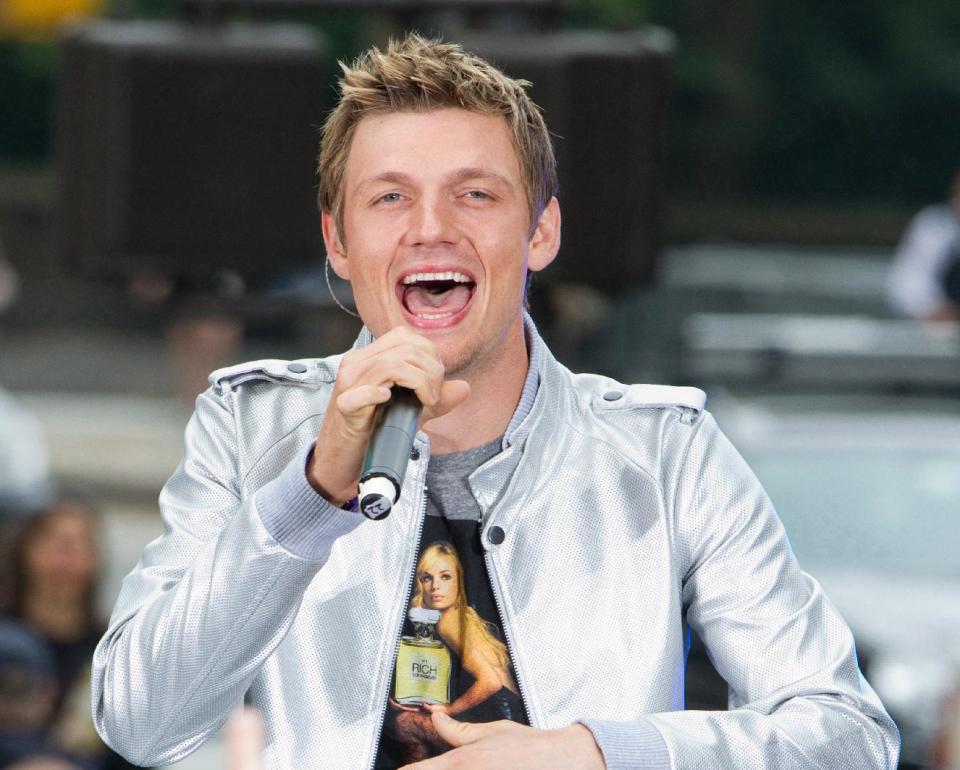 FILE - This May 24, 2010 file photo shows Nick Carter of the Backstreet Boys performing on CBS News' "The Early Show" in New York. The Backstreet Boys singer proposed to his fitness trainer girlfriend Lauren Kitt in February, and he says they may bring their marriage to the small screen. “There have been offers and opportunities to film the actually wedding, like a TV show,” the 33-year-old said in a recent interview. The couple appears together in a series of fitness webisodes called “Kit Fitt.” (AP Photo/Charles Sykes, file)