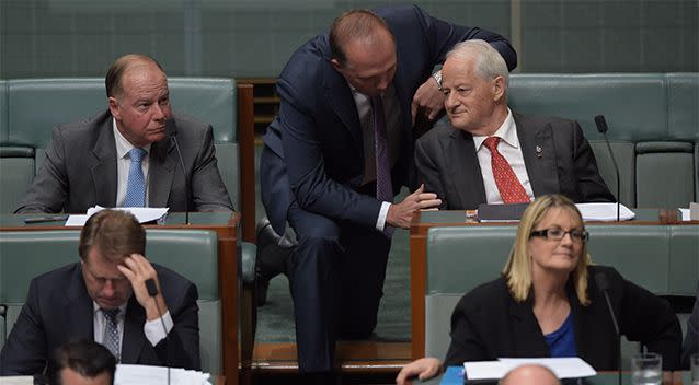 Liberal back bencher Philip Ruddock (right) speaks to Australian Immigration Minister Peter Dutton (centre) during House of Representatives Question Time at Parliament House in Canberra, Monday, February 8, 2016. Photo: AAP