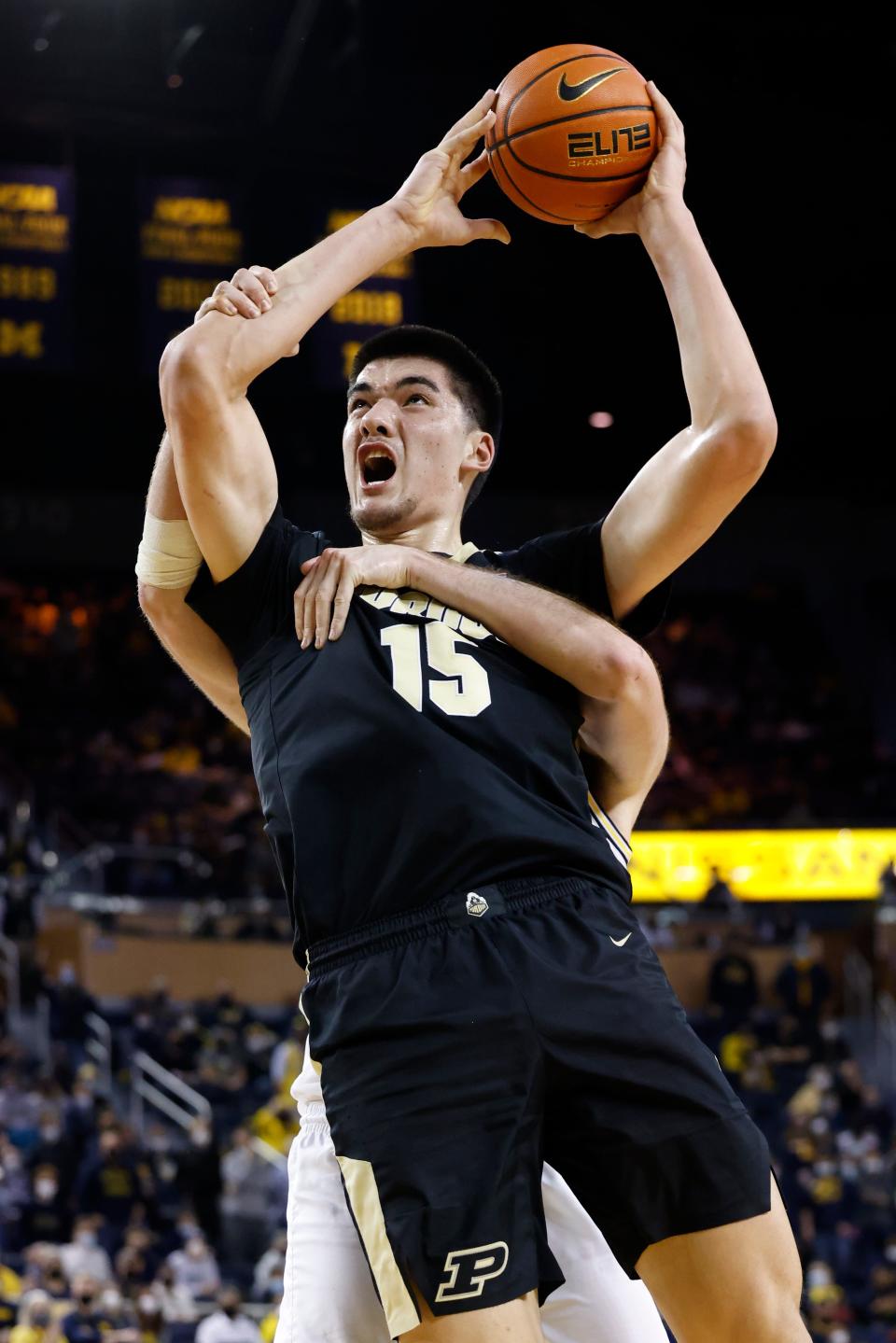 Purdue Boilermakers center Zach Edey (15) is fouled by Michigan Wolverines center Hunter Dickinson (1) in the second hal Feb. 10, 2022 at Crisler Center.