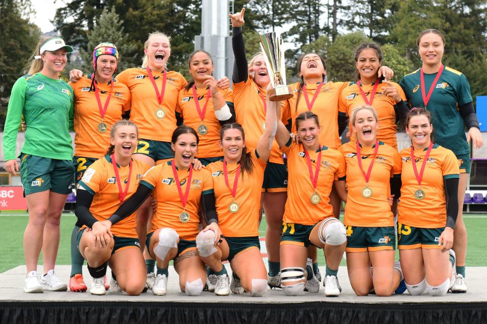 Aussie players, pictured here after winning the Women's World Rugby Sevens tournament in Canada.
