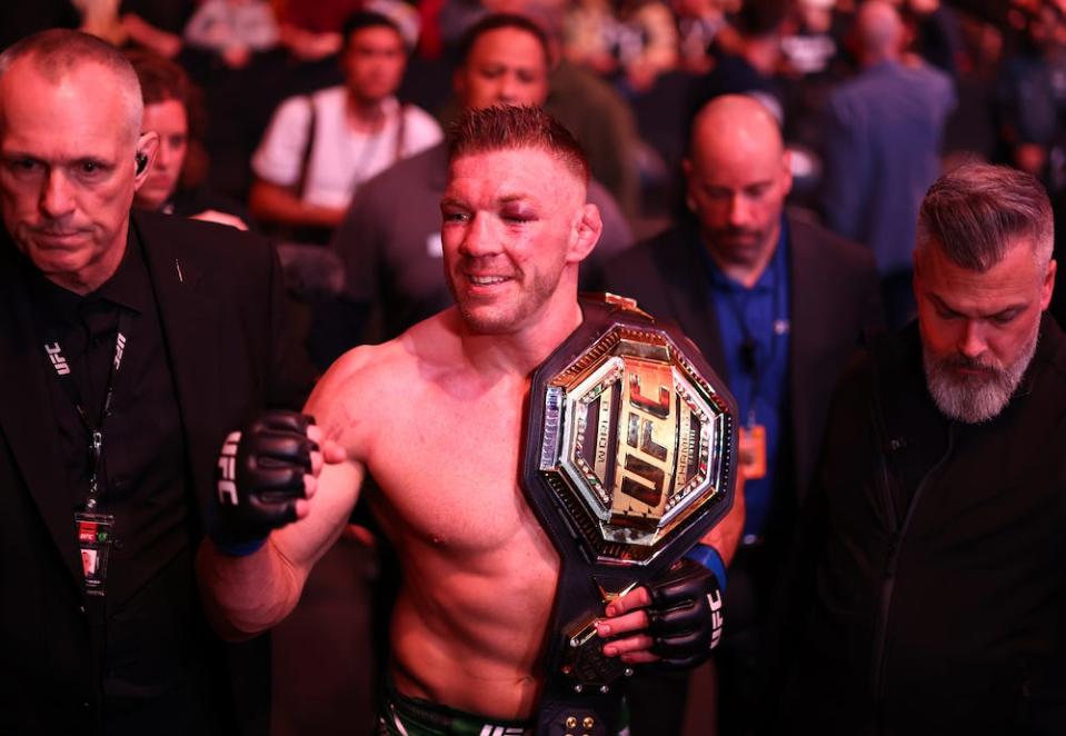 TORONTO, ON - JANUARY 20: Dricus Du Plessis of South Africa celebrates with the middleweight title belt following his win over Sean Strickland of the United States during the UFC 297 event at Scotiabank Arena on January 20, 2024 in Toronto, Ontario, Canada. (Photo by Vaughn Ridley/Getty Images)