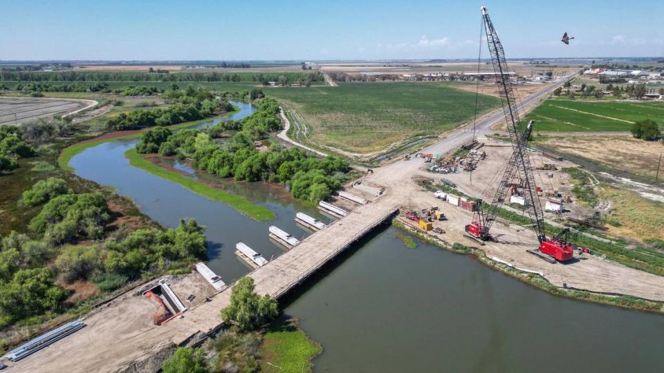 The Kings River bridge on Highway 41 near Stratford in Kings County is shown under construction in this drone image on Thursday, May 16, 2024. The former bridge was built in 1942 and in need of replacement due to deterioration and seismic retrofitting requirements. The new bridge is expected to be completed later this summer.