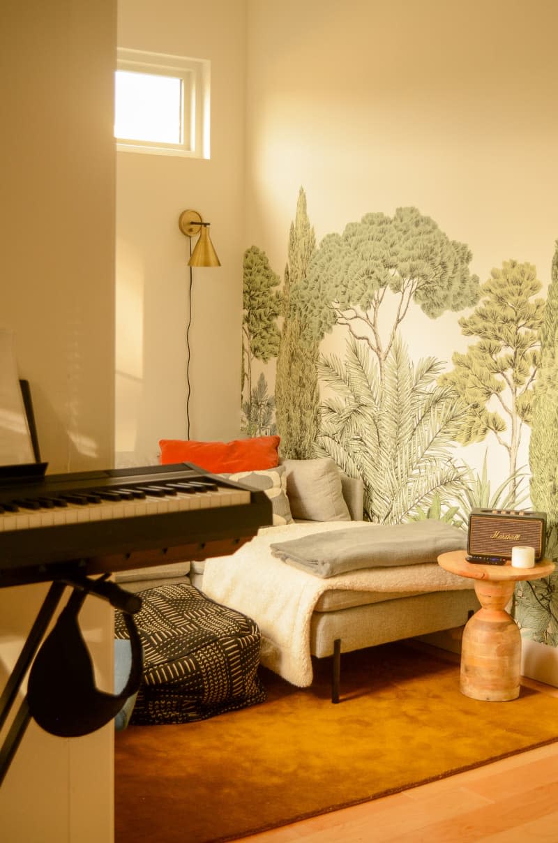 Woodland mural painted on bedroom wall.