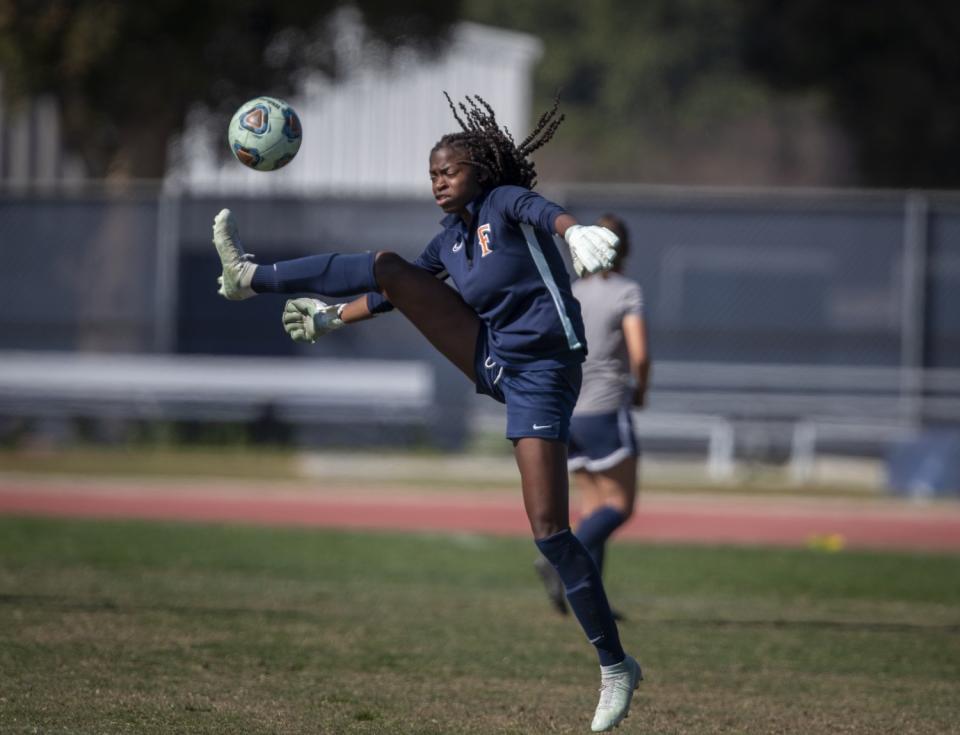 Cal State Fullerton soccer goal keeper DeAira Jackson, shown at practice, made the training squad for the U.S. Rugby Sevens Olympic team.