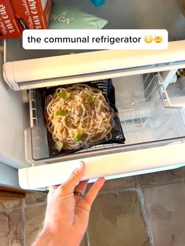 <p>Elle McLemore</p> Frozen Cacio e Pepe in the communal refrigerator.