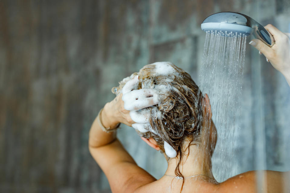 woman washing hair in shower