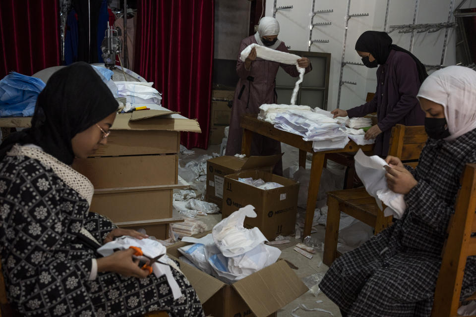 Palestinian women sew diapers in Rafah, southern Gaza Strip, Thursday, Feb. 15, 2024. Palestinians in Gaza have experienced severe shortages of basic necessities since the war began on Oct. 7. (AP Photo/Fatima Shbair)