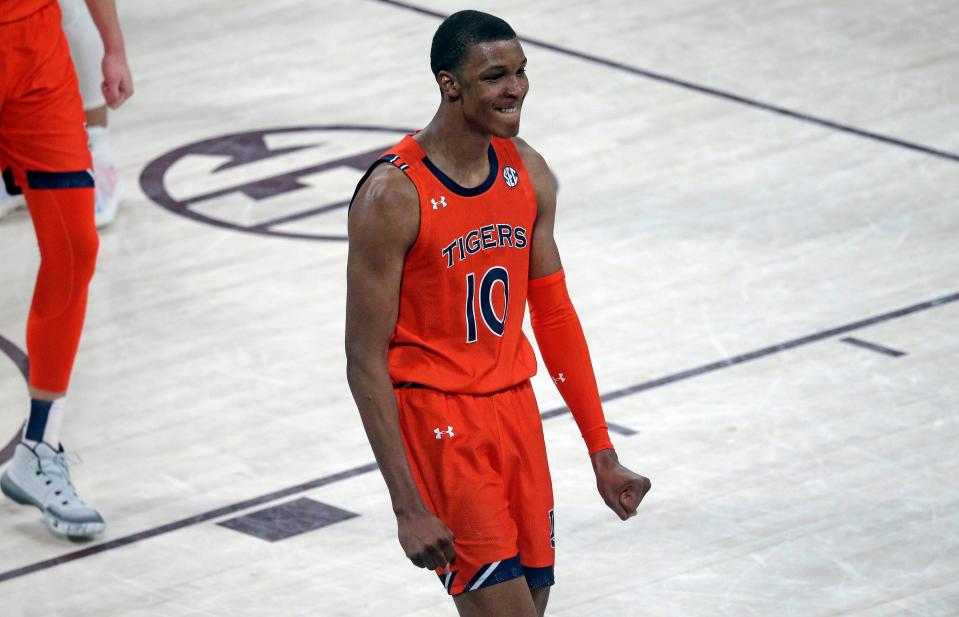 Auburn forward Jabari Smith reacts after a dunk during overtime vs. Mississippi State on March 2, 2022 in Starkville, Mississippi.