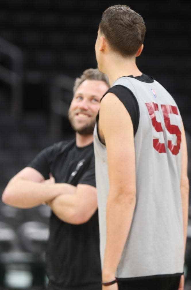 Duncan Robinson, a New Castle native, talks to a member of the Miami Heat staff at Tuesday's practice at TD Garden ahead of Wednesday's Game 2 of the NBA Eastern Conference first-round matchup with the Boston Celtics.