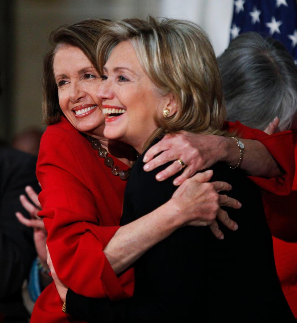 House Speaker Nancy Pelosi hugs then-Secretary of State Hillary Rodham Clinton during a 2010 Women History Month celebration.