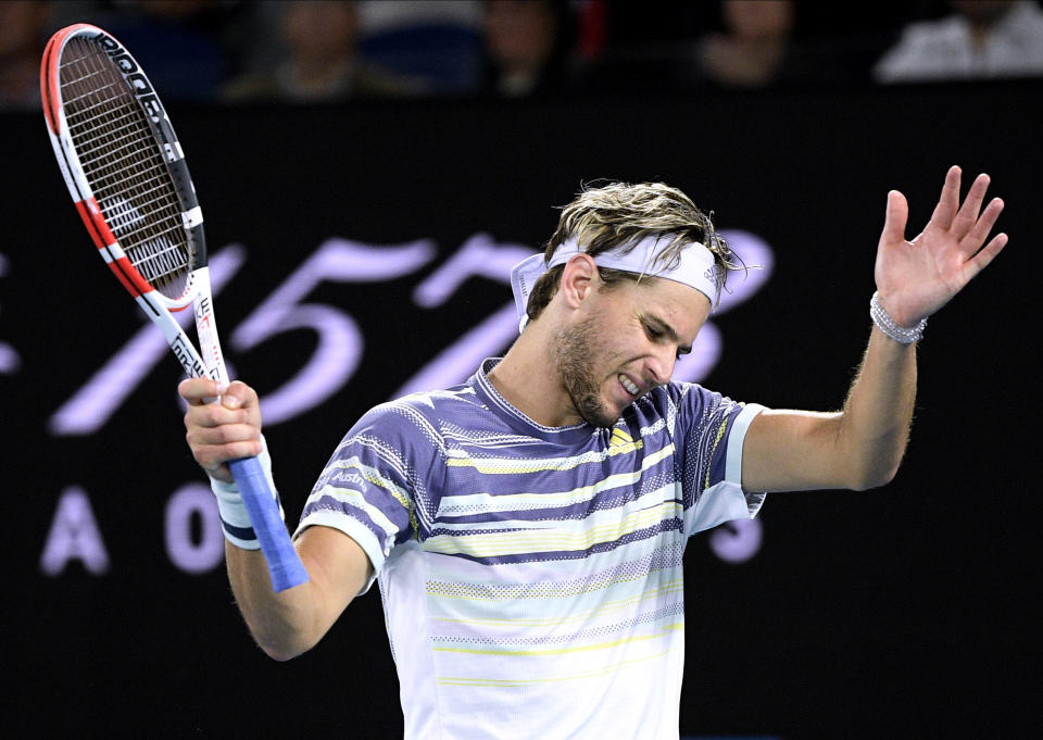 Austria's Dominic Thiem reacts during his men's singles final against Serbia's Novak Djokovic at the Australian Open tennis championship in Melbourne, Australia, Sunday, Feb. 2, 2020. (AP Photo/Andy Brownbill)