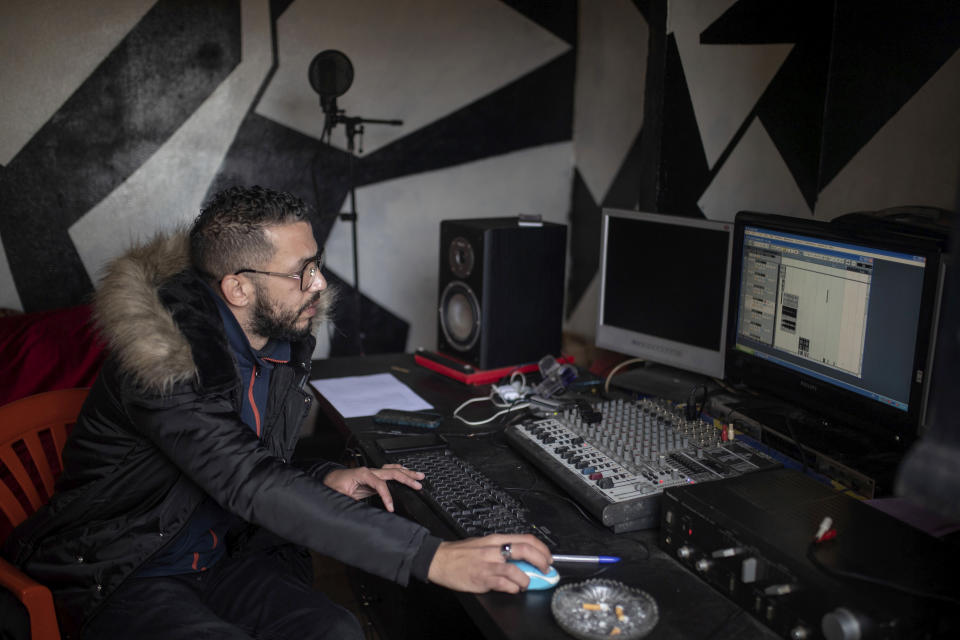 In this Thursday, Nov. 21, 2019 photo, Moroccan rapper Yahya Semlali, 31, known as LZ3er, works in his studio in Fes, Morocco. (AP Photo/Mosa'ab Elshamy)
