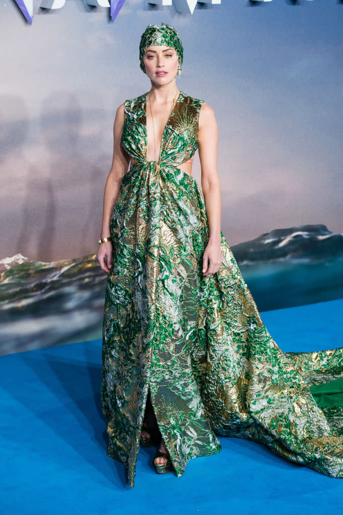 <p>Usually one to play it safe on the red carpet, actress Amber Heard surprised the fashion industry by wearing a couture swimming cap on the red carpet. The floral headpiece by Pierpaolo Piccioli for Valentino matched her aqua-themed jacquard dress and we were admittedly into it. What do you think? <em>[Photo: Getty]</em> </p>