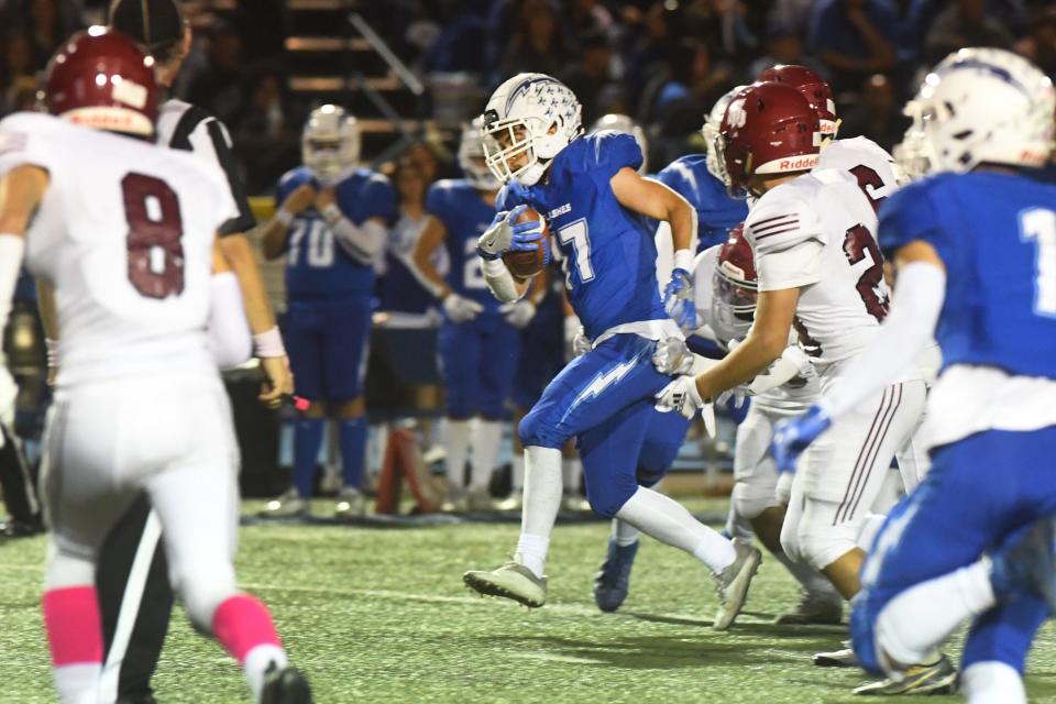 Fillmore's David Jimenez tries to break through the Santa Paula defense during the teams' Citrus Coast League game at Fillmore High on Friday, Oct. 28, 2022. The Flashes won 35-28 to secure the outright league championship in the 112th meeting between the rival schools. Jimenez rushed for 111 yards and a TD on just nine carries.