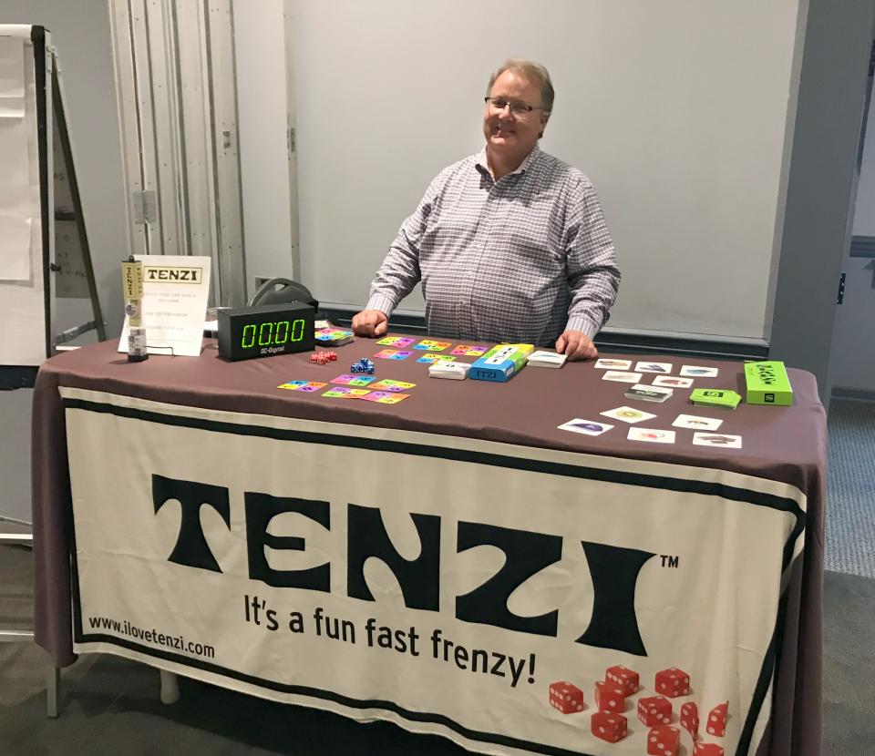 Rick Goss works st the Tenzi booth at the initial BroCoCon in 2019.