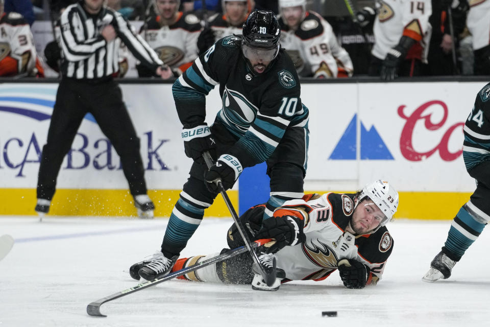 San Jose Sharks left wing Anthony Duclair (10) and Anaheim Ducks center Mason McTavish (23) compete for possession of the puck during the second period of an NHL hockey game Thursday, Feb. 29, 2024, in San Jose, Calif. (AP Photo/Godofredo A. Vásquez)