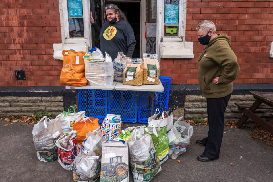 A food bank accepts a donation on October 20, 2020 in Ashton under Lyne, England.<span class="copyright">Getty Images—2020 Anthony Devlin</span>