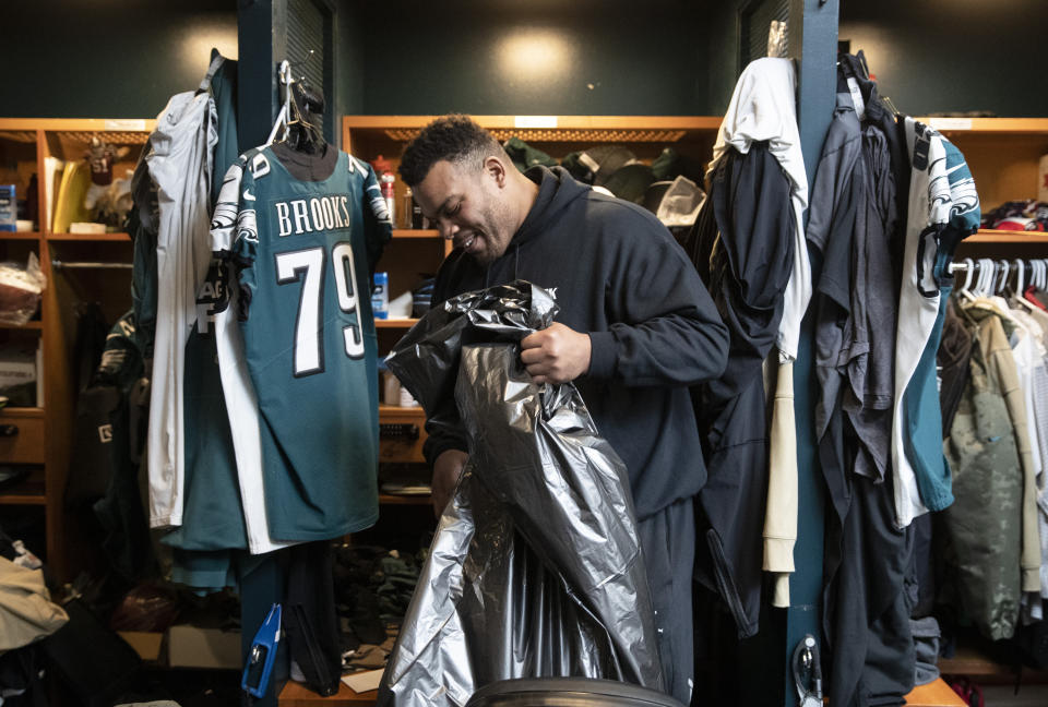 Philadelphia Eagles offensive guard Brandon Brooks cleans out his locker at the NFL football team's practice facility in Philadelphia, Monday, Jan. 6, 2020. The Eagles ended their season with a 17-9 loss to the Seattle Seahawks on Sunday. (AP Photo/Matt Rourke)