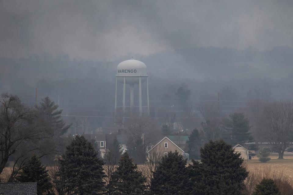 Smoke wafts over the horizon from the fire at C6-Zero on Thursday, Dec. 8, 2022, in Marengo, Iowa. The plant breaks down asphalt shingles into fiberglass, gravel and oil.