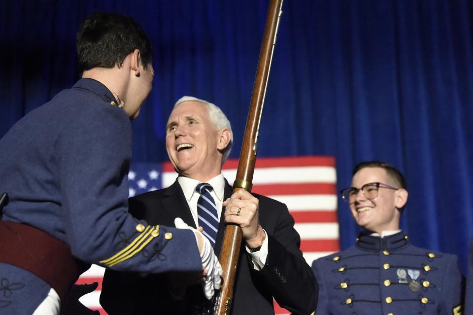 Vice President Mike Pence receives a musket as part of the Nathan Hale Patriot Award from The Citadel Republican Society on Thursday, Feb. 13, 2020, in Charleston, S.C. (AP Photo/Meg Kinnard)