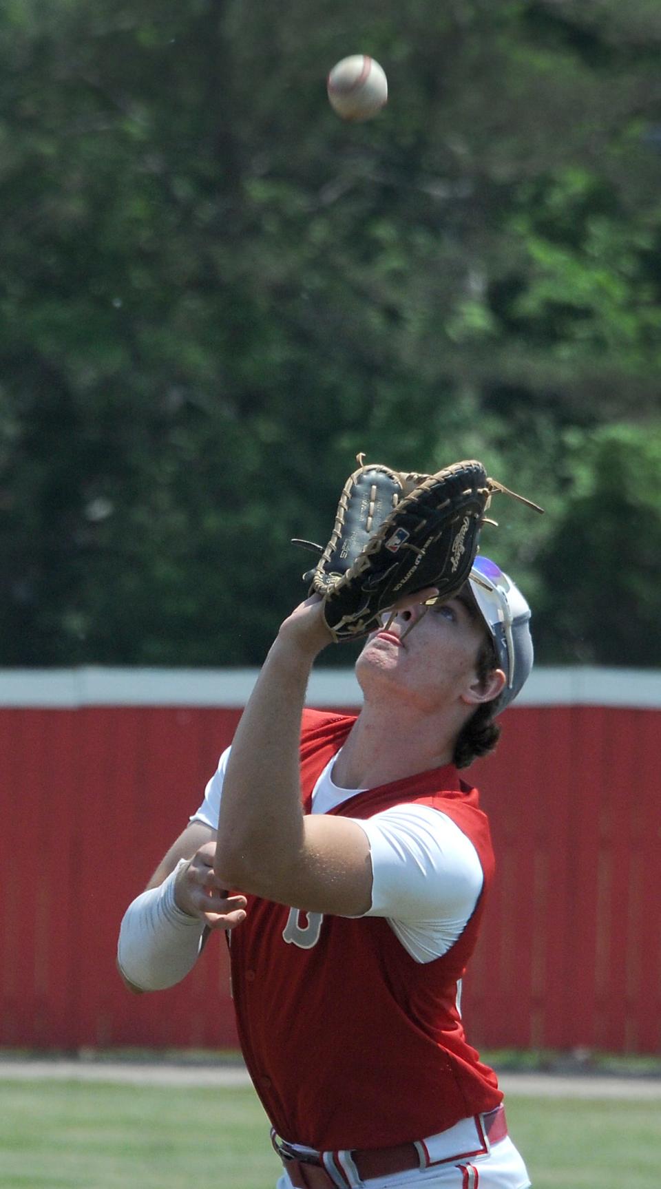 First baseman  Nolan Laskey of Bedford caches a pop up against Ypsilanti Lincoln in the Division 1 District semifinals at Monroe Saturday. Bedford won the game 5-3 and went onto win the final over Belleville 11-3.