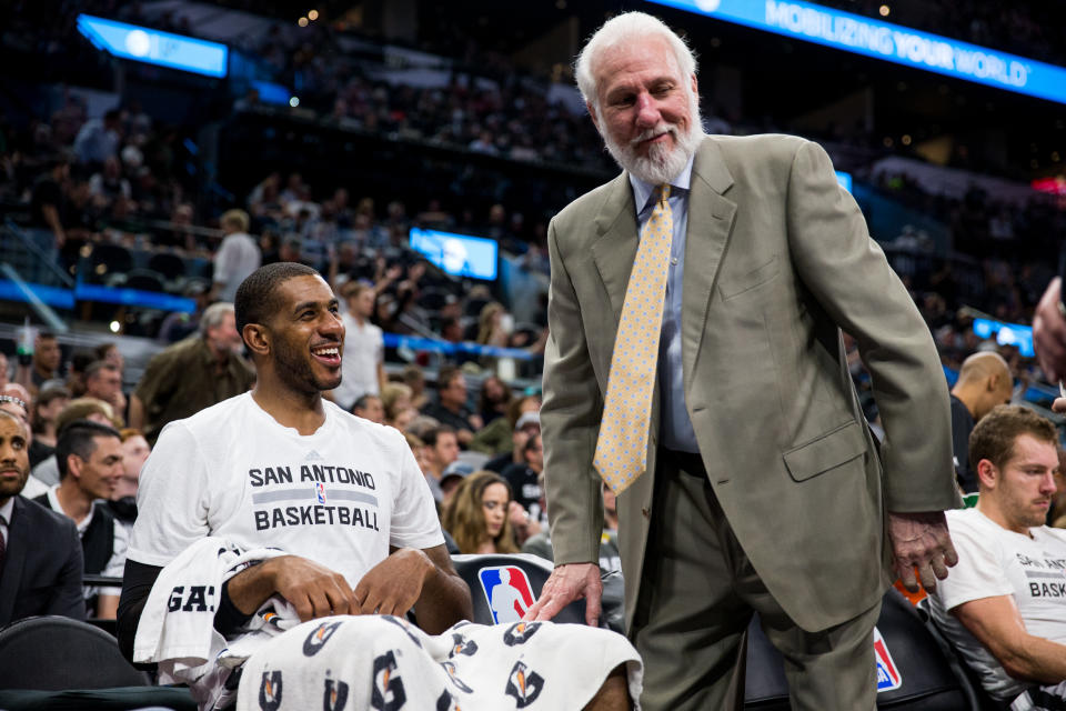 LaMarcus Aldridge and Gregg Popovich get on the same page. (AP)