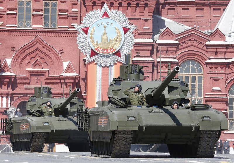 Russian servicemen drive T-14 