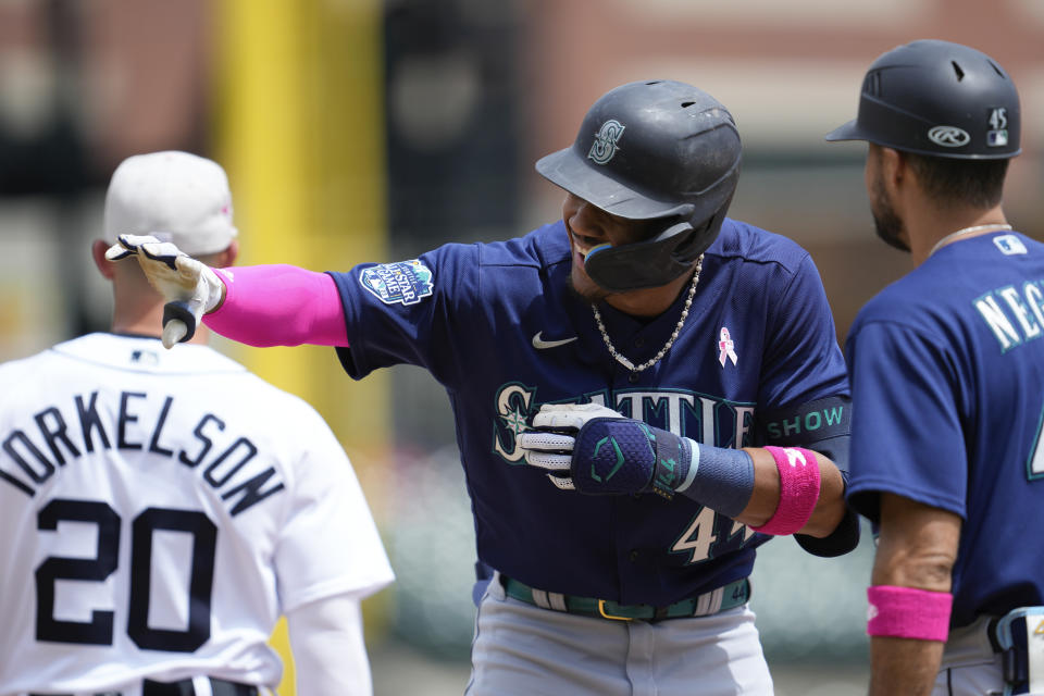 Seattle Mariners' Julio Rodriguez (44) celebrates his one-run single against the Detroit Tigers in the third inning of a baseball game, Sunday, May 14, 2023, in Detroit. (AP Photo/Paul Sancya)