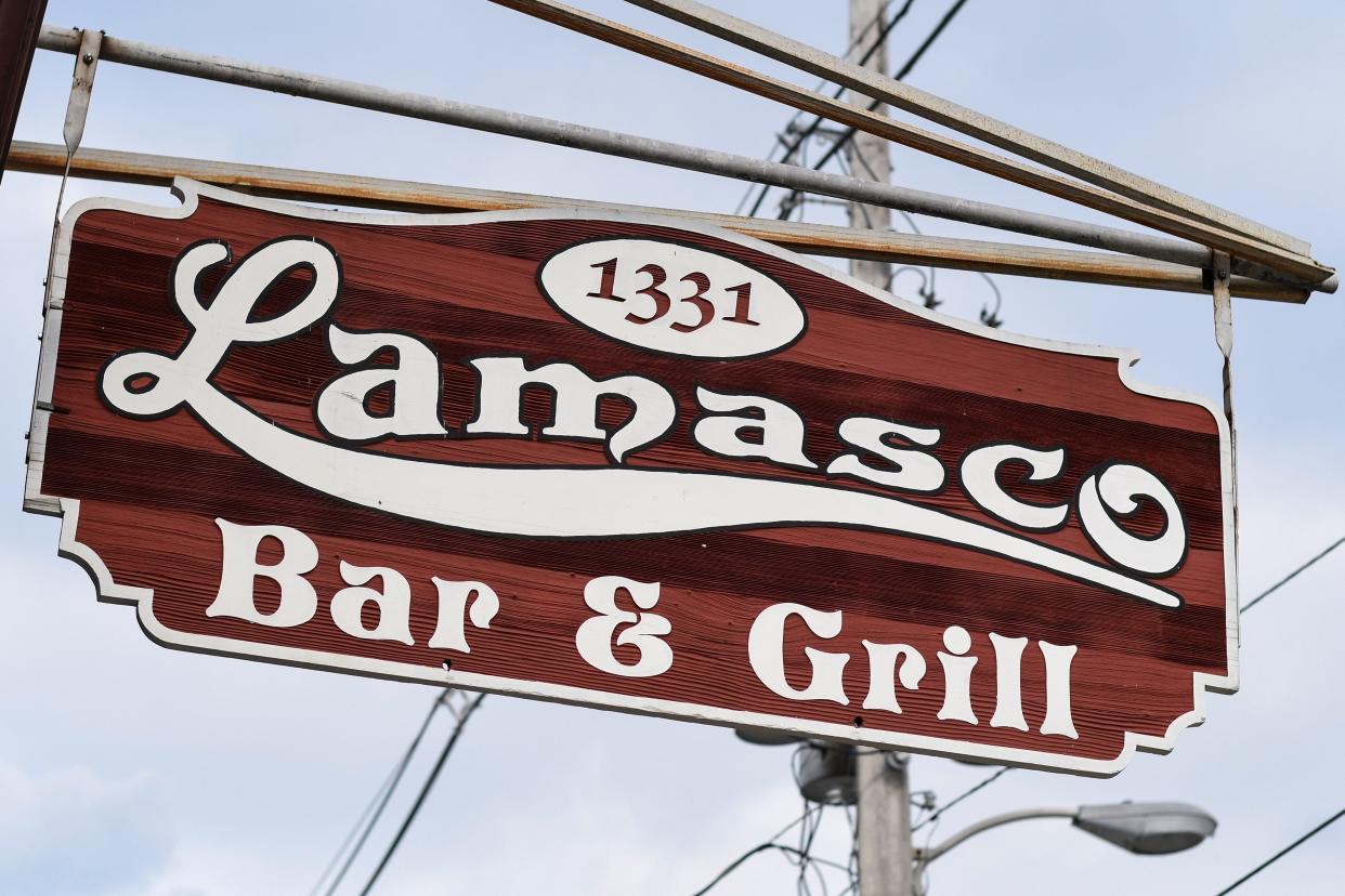 The Lamasco Bar & Grill's sign hangs outside the establishment.