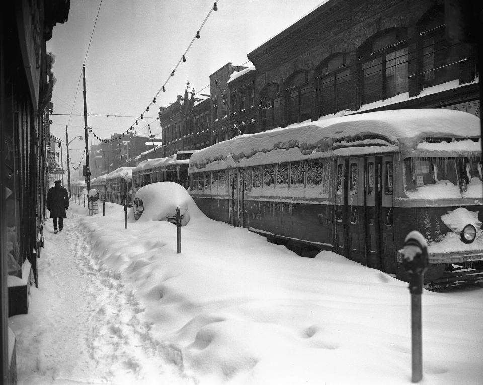 Fifteen street cars are lined up and out of service on Carson Street in Pittsburgh, Pa., November 26, 1950 due to a Winter snow storm.