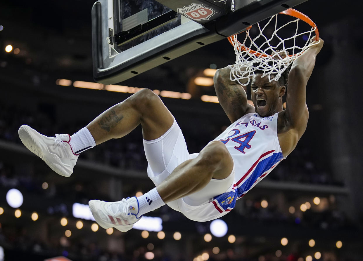 K.J. Adams Jr. #24 of the Kansas Jayhawks dunks the ball during the first half in the second round against the Cincinnati Bearcats of the Big 12 Men's Basketball Tournament at T-Mobile Center on March 13, 2024 in Kansas City, Missouri.  (Photo by Jay Biggerstaff/Getty Images)