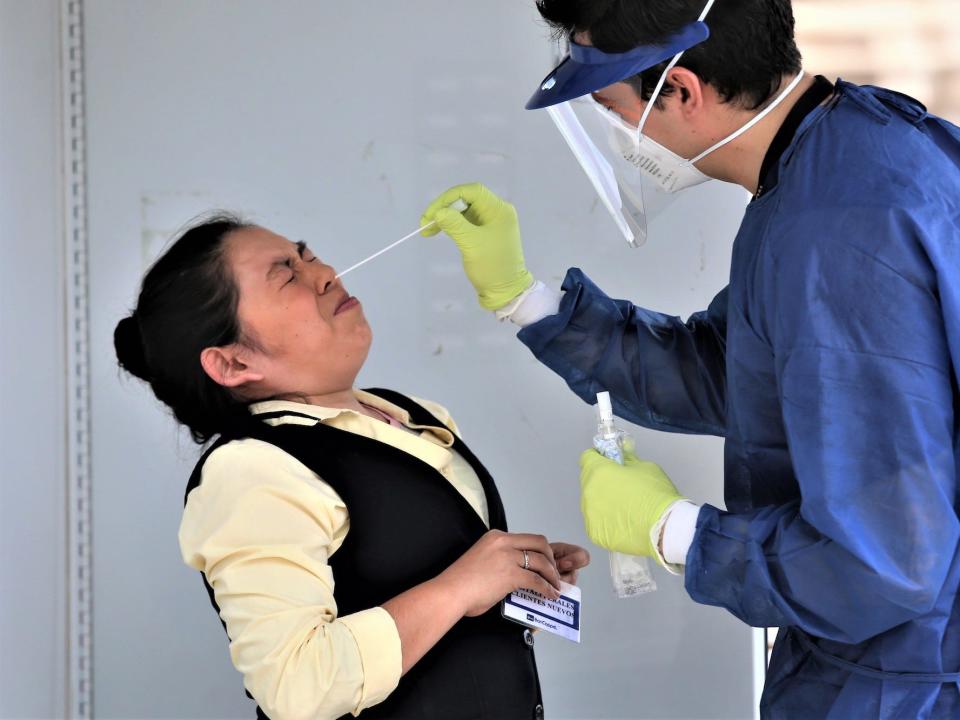 A member of the Monterrey´s health system performs a coronavirus test on a woman on April 9 in Monterrey.