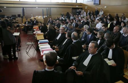 Lawyers sit behind legal dossiers at the start of the trial of Air France employees at the courthouse in Bobigny, France, May 27, 2016. REUTERS/Gonzalo Fuentes