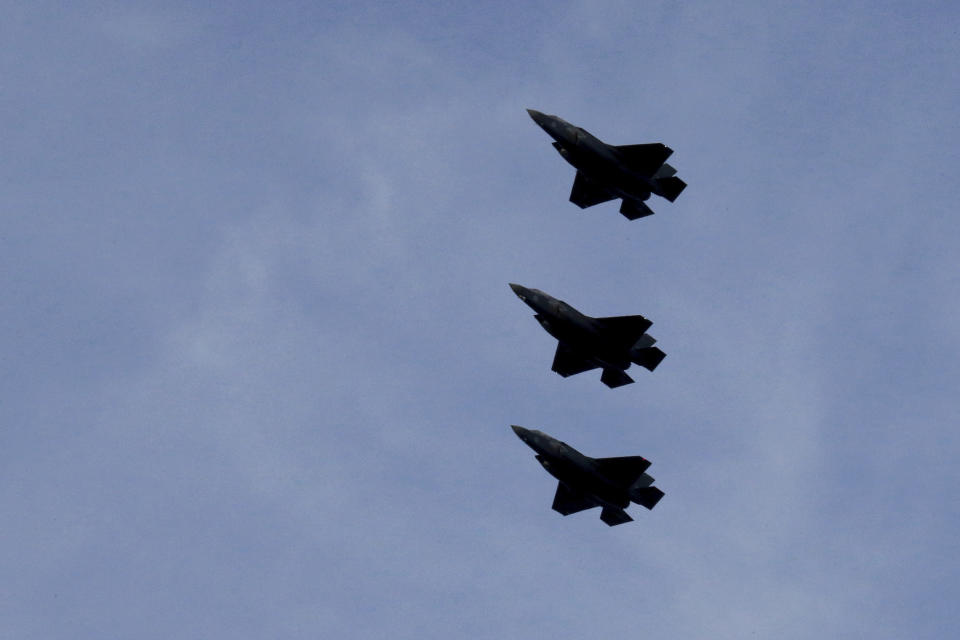 FILE - In this Tuesday, May 21, 2019 file photo, F-35B aircrafts fly over the Akrotiri Royal air forces base before landing, near city of Limassol, Cyprus. Britain's defense secretary said the country's most advanced military aircraft, the Lightning F-35B, that is undergoing training at a British air base in Cyprus has flown its first missions over Syria and Iraq as part of the ongoing operations against the Islamic State group, in a statement issued Tuesday June 25, 2019. (AP Photo/Petros Karadjias, File)