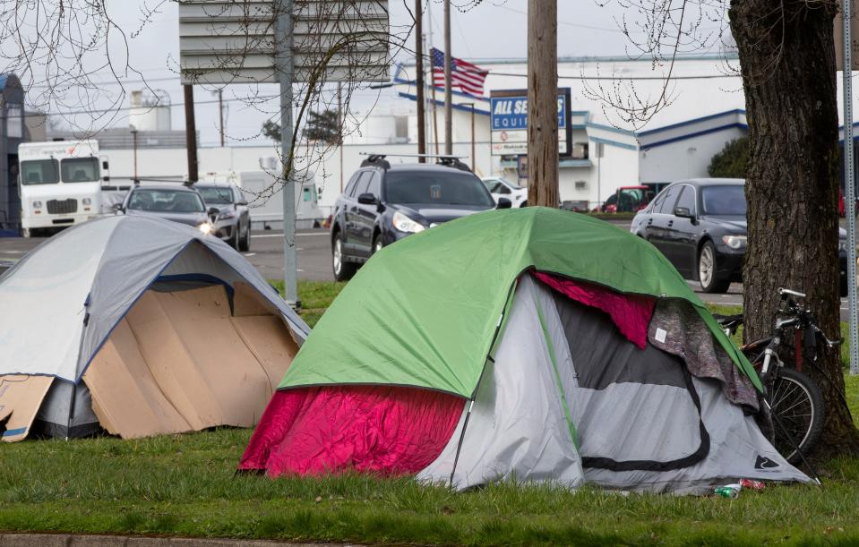 A camping site takes shape in February in a grassy area along West 7th Avenue in Eugene.