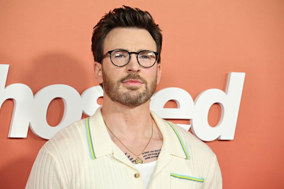 chris evans wearing glasses and a cream shirt over a white top