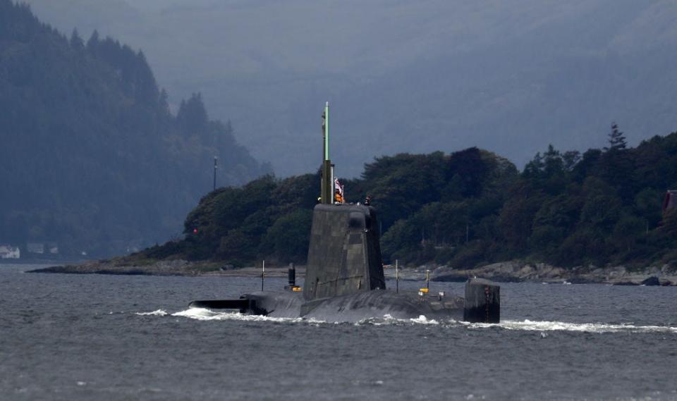 One of the Royal Navy's seven Astute-class nuclear-powered attack submarine moves through the water at the entrance to Holy Loch and Loch Long near Kilcreggan, in Argyll and Bute