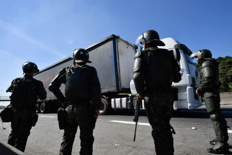 Soldiers take part in an operation to clear highway Regis Bittencourt, 30 km from Sao Paulo, as a truckers' strike against rising fuel costs in Brazil that has left much of the country paralyzed, is now over