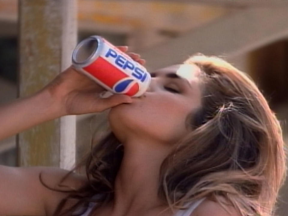 402614 01: Supermodel Cindy Crawford drinks a Pepsi in an award-winning ad produced for regular Pepsi in 1991, in which a pair of awestruck boys watched Crawford approach a Pepsi vending machine. Crawford will star in a new Diet Pepsi commercial during the 74th Annual Academy Awards airing March 24, 2002 on ABC-TV. (Photo by Pepsi/Getty Images)